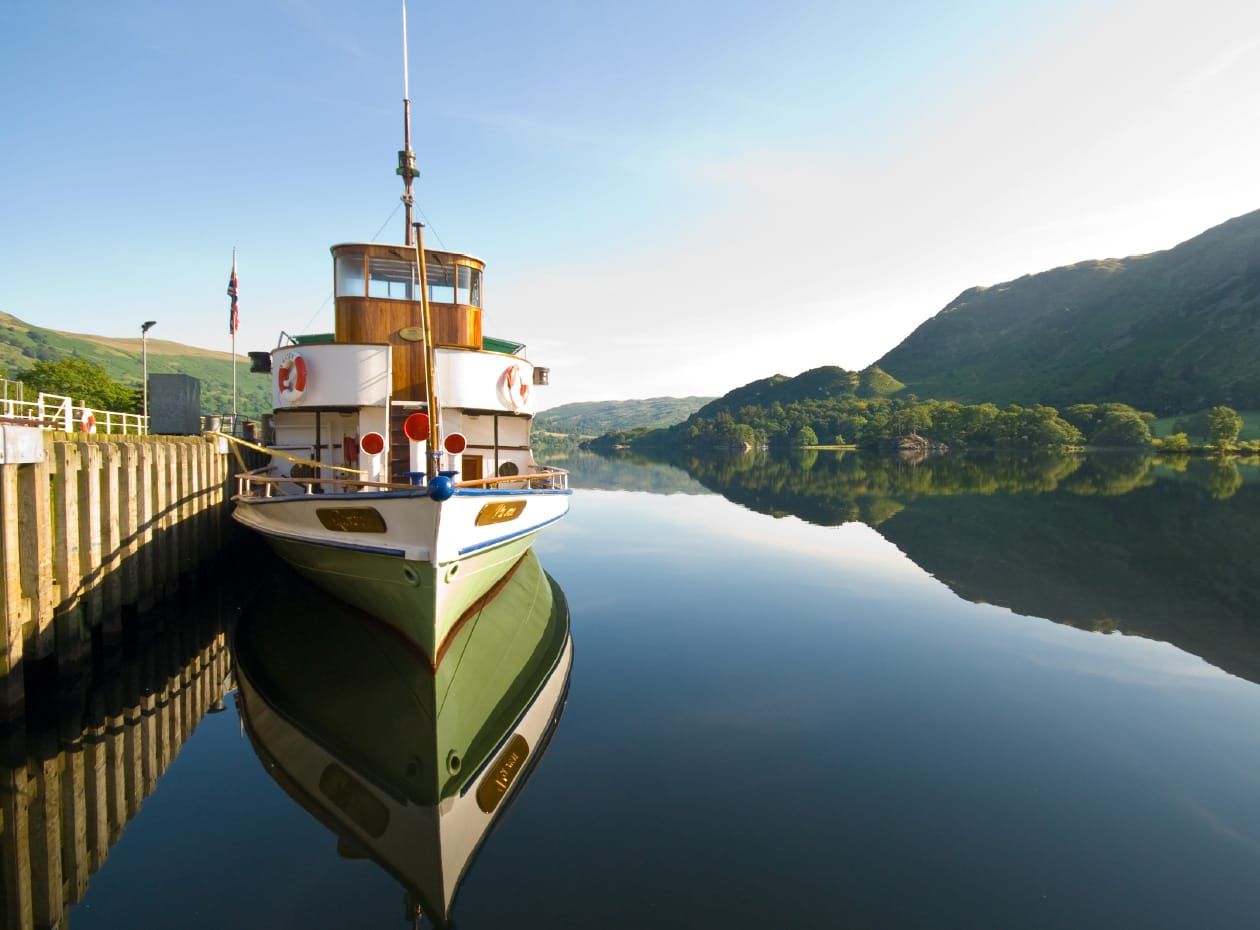 Heritage boat M.Y. Raven at Glenridding pier on a calm still day on Ullswater